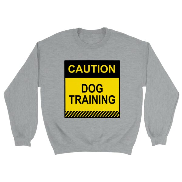 Sweatshirt reading "Caution, Dog Training" in yellow and black letters for dog training