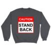 Grey sweatshirt reading "Caution, Stand Back" in red and black used to keep people away