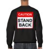 Back of Black sweatshirt reading "Caution, Stand Back" in red and black used to keep people away