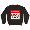 Dark sweatshirt reading "Caution, Stand Back" in red and black to keep people away